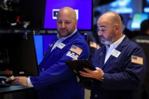 Traders work on the floor of the NYSE in New