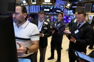 Traders work on the floor of the NYSE in New