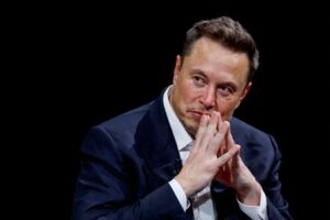 FILE PHOTO: Elon Musk, owner of X, formerly Twitter, gestures