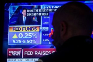 FILE PHOTO: Traders react to Fed rate announcement on the