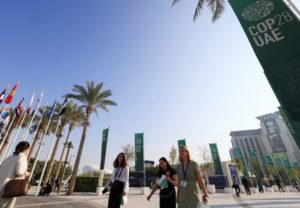 People walk at Dubai's Expo City during the United Nations