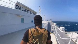 FILE PHOTO: Houthi fighter stands on the Galaxy Leader cargo